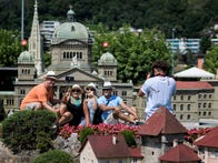 <p>Tourists in Switzerland use their smartphones to take "selfies" while on vacation.</p>