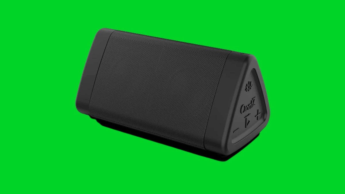 A black Oontz Angle 3 speaker against a green background.