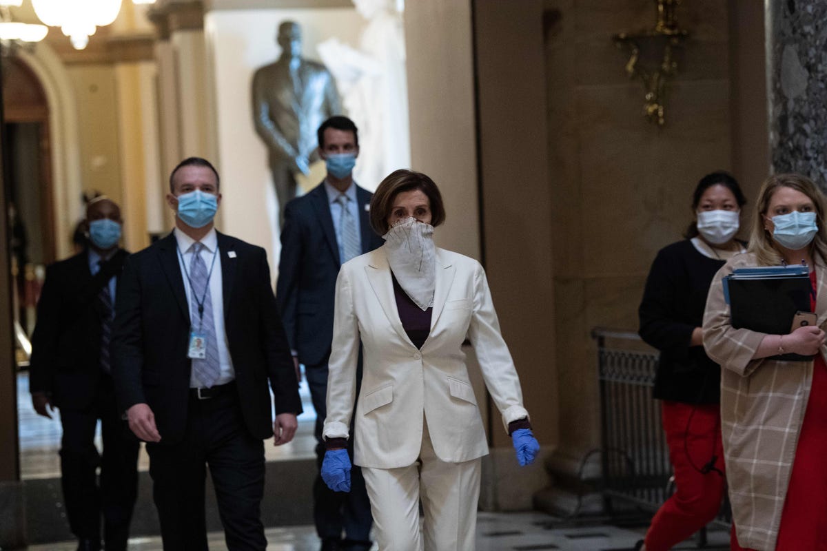 Nancy Pelosi with scarf as mask