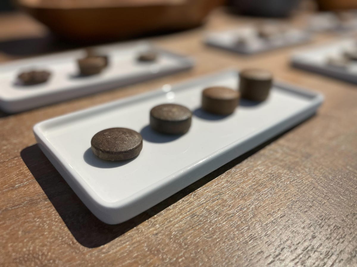 four coffee pods on display at the launch event