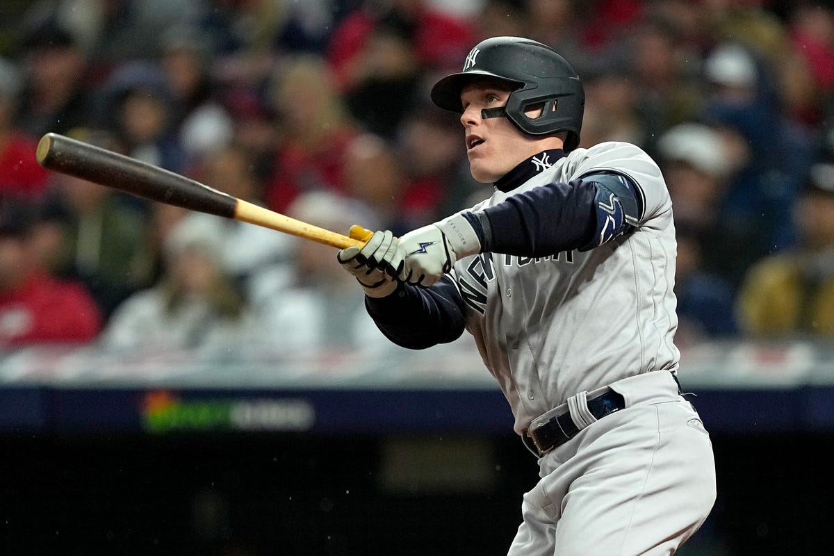 Harrison Bader of the New York Yankees swings a bat.