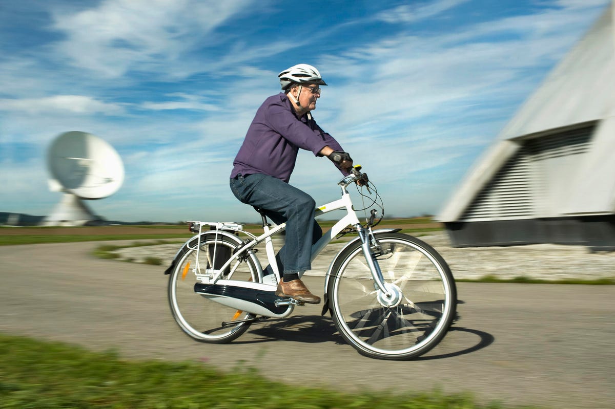Elderly man riding an e-bike