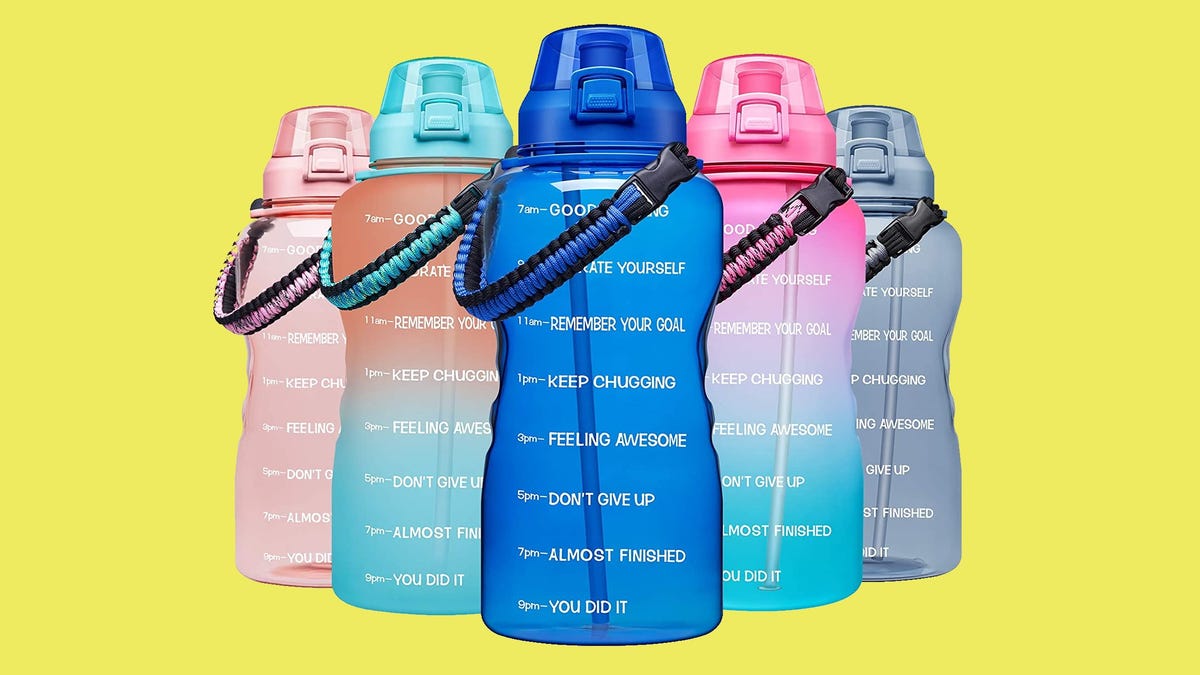 Five Giotto water bottles against a yellow background.