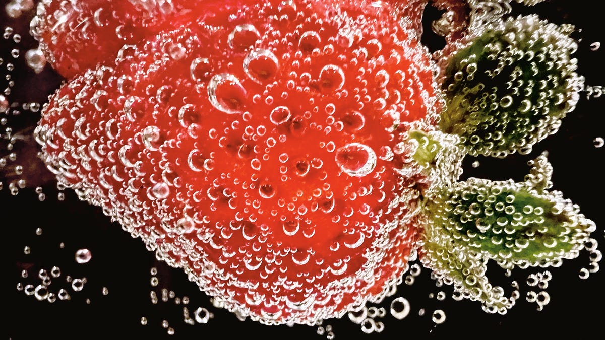 A macro photo of a strawberry.