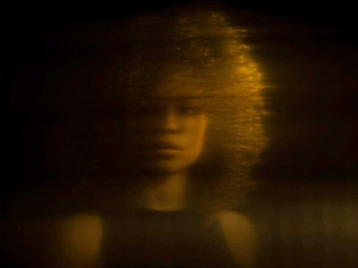 blurry image of a woman 