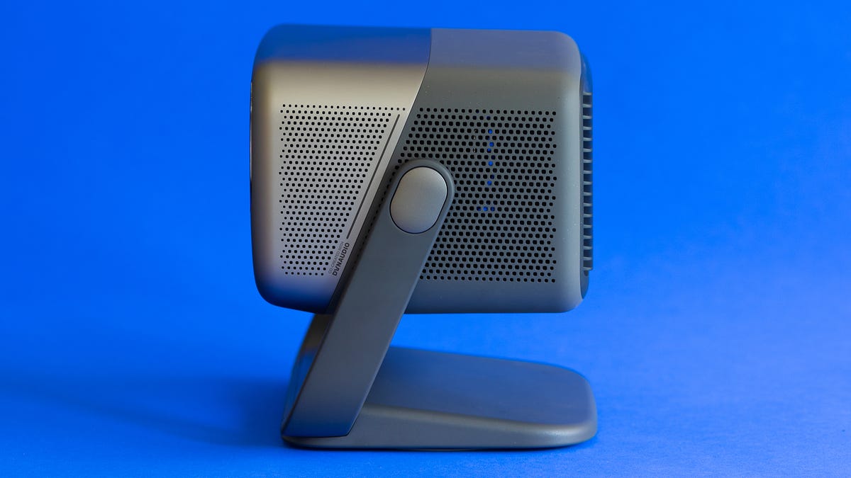 A side view of the JMGO N1 Ultra on a blue background.