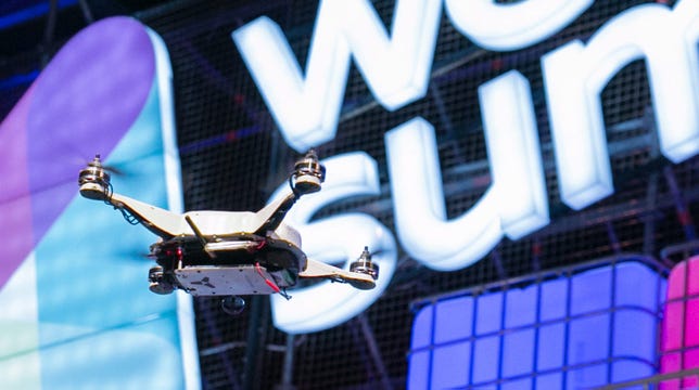 A SkyCatch-built drone flies over the stage at Web Summit in Dublin, Ireland.