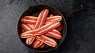 Vegan bacon in a cast iron skillet.