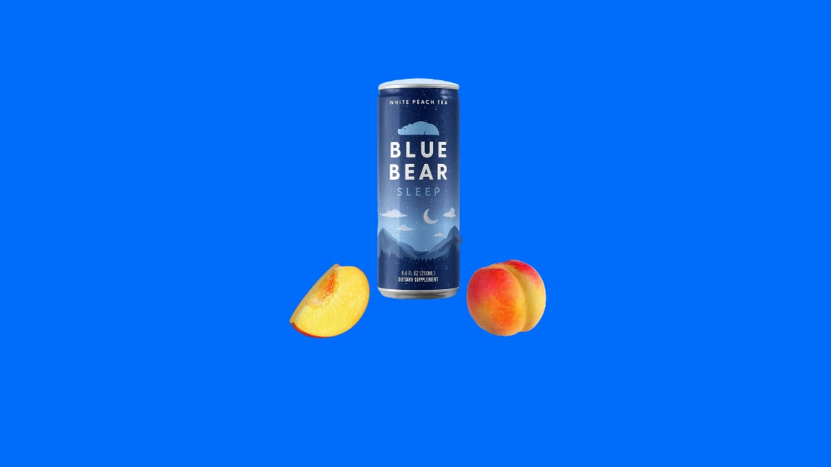 A can of Blue Bear White Peach Tea on a blue background