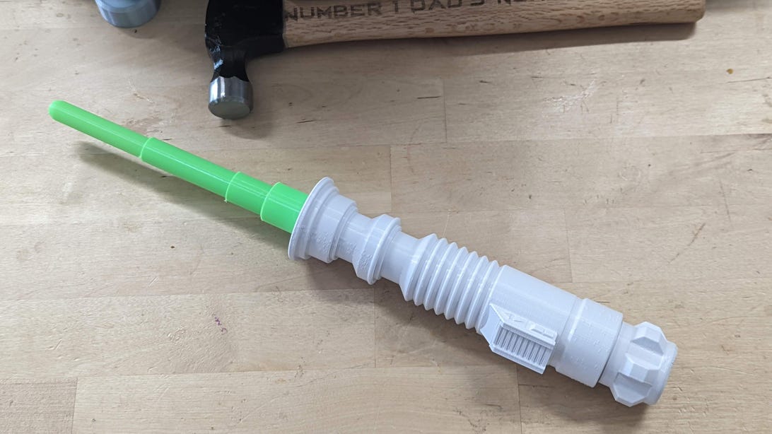 White 3D-printed lightsaber with green blade