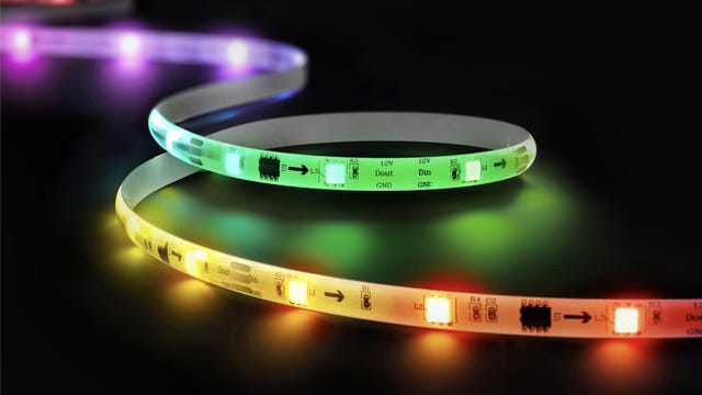 A slightly coiled Wyze Light Strip Pro lit up with multiple colors