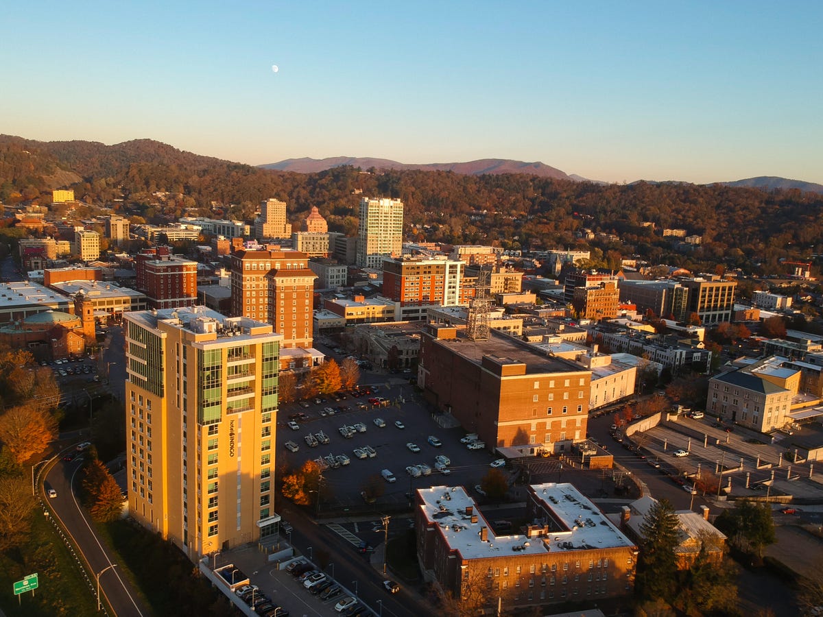Aerial drone view, taken during the autumn season, of downtown Asheville, North Carolina, a city in the Blue Ridge Mountains.