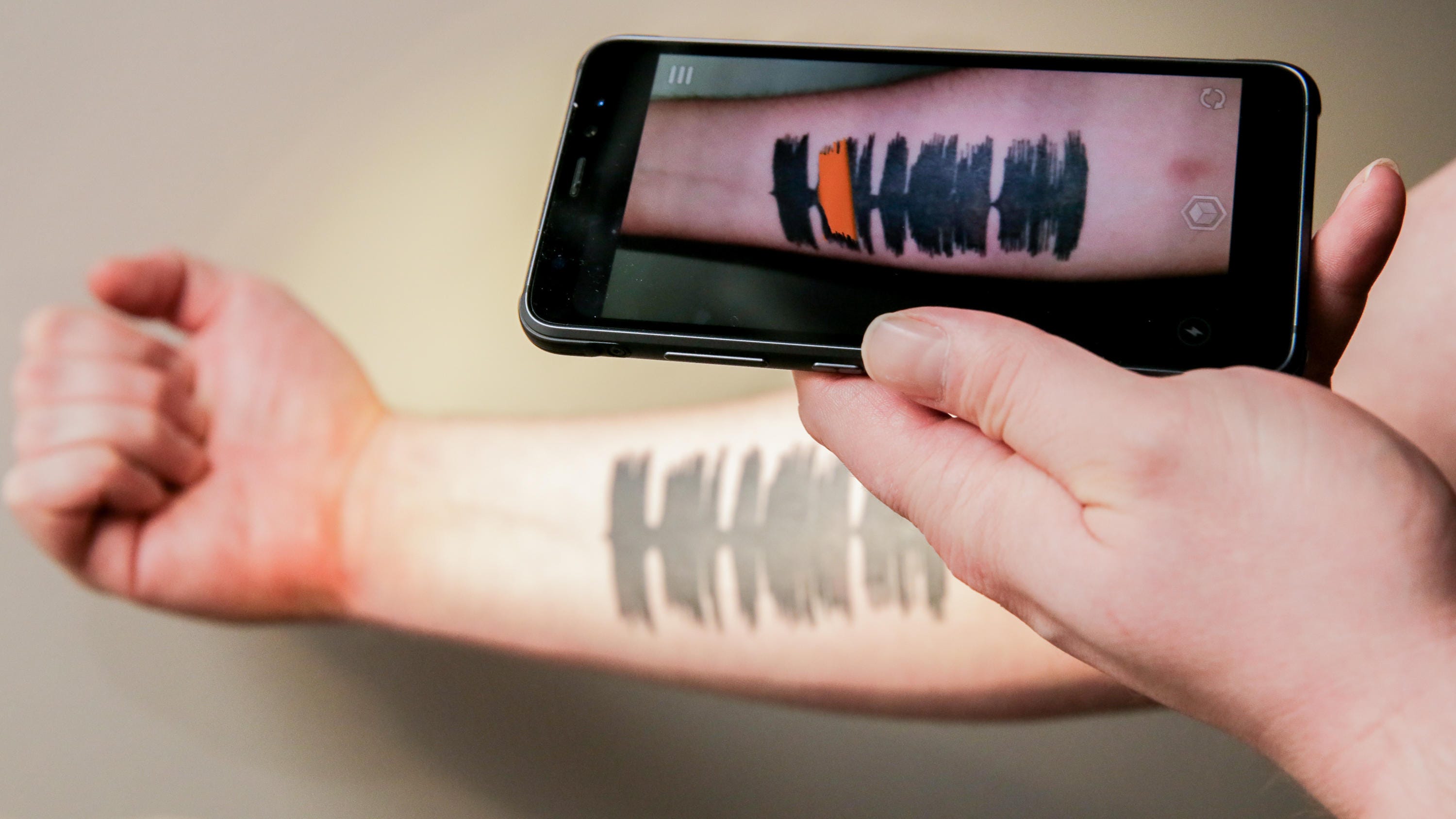 Skin Motion app turns my tattoo into sound waves - CNET