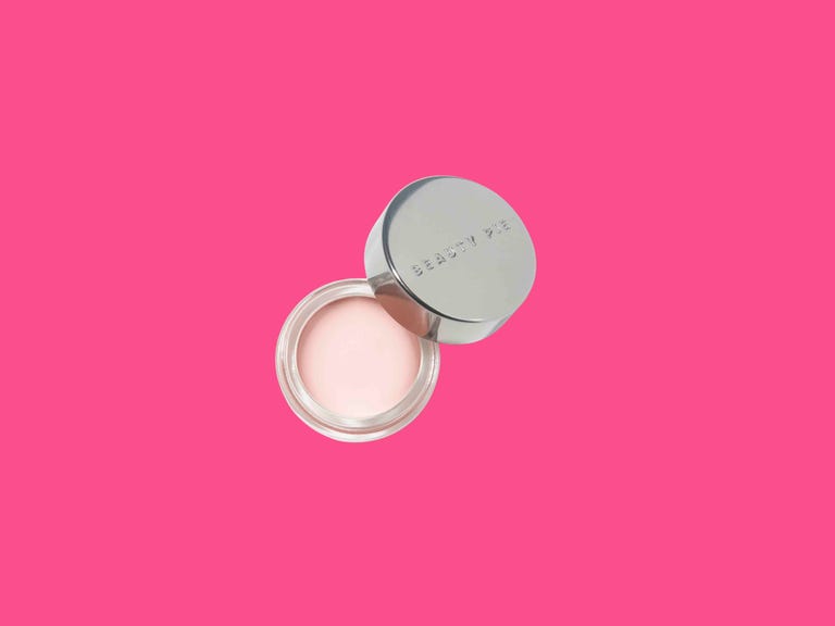 Beauty Pie's tinted eye cream on top of a colorful background.