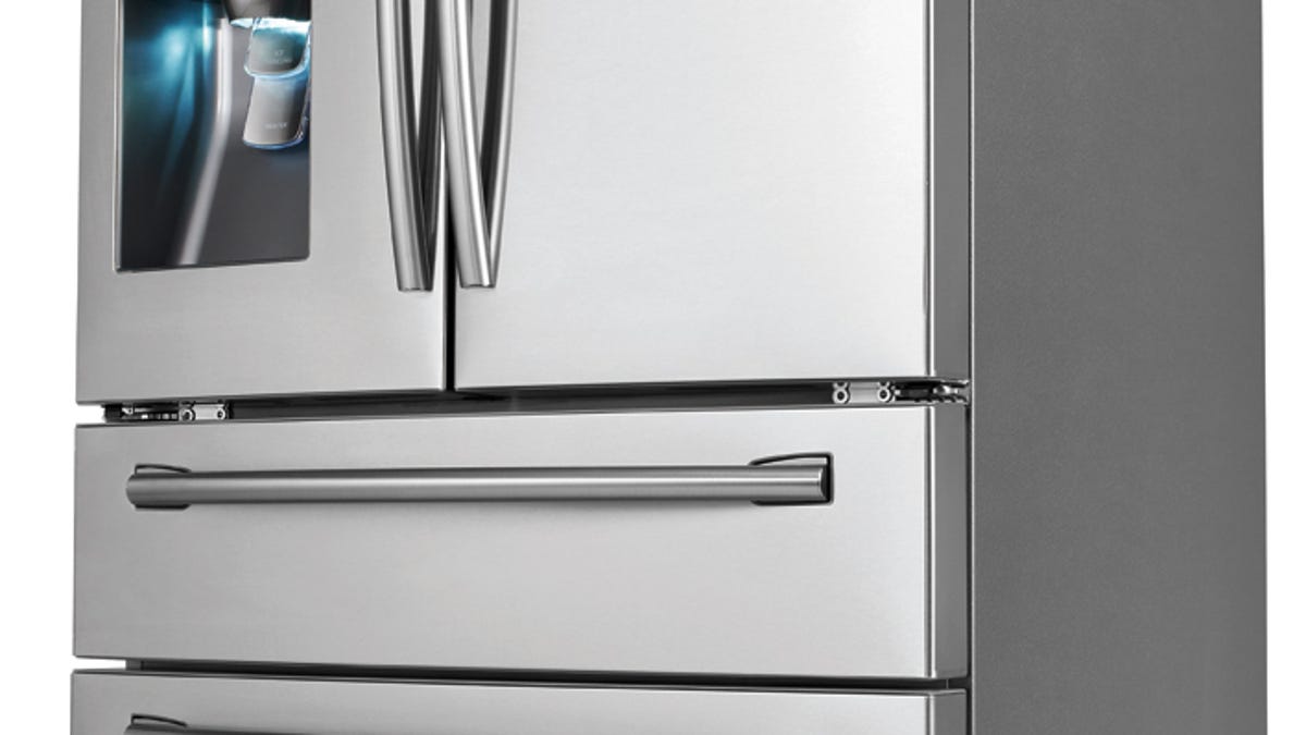The Samsung RF31FMESBSR Refrigerator bubbles the fridge door forward with an integrated SodaStream dispenser.