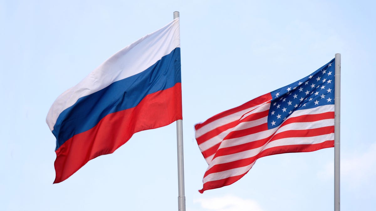 Russian and American flags flying side by side