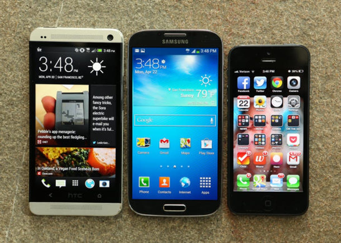 HTC's One, left, alongside the Galaxy S4 and iPhone 5.