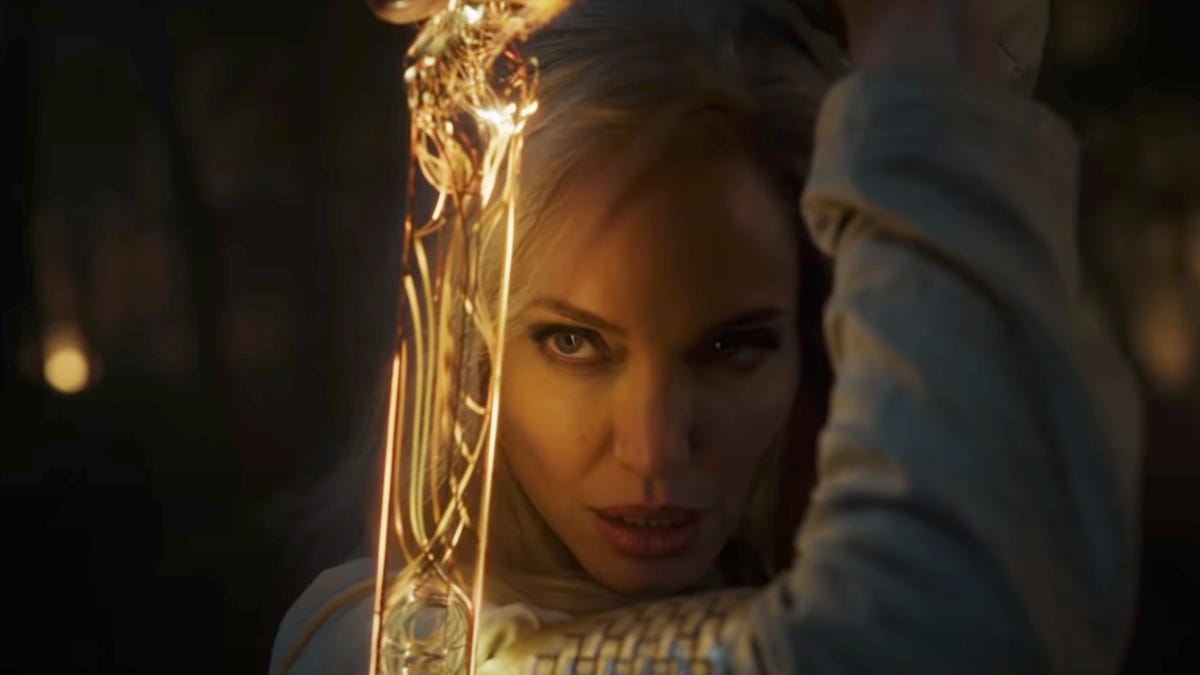 Angelia Jolie stars in Eternals, the light from a magic sword illuminating her face