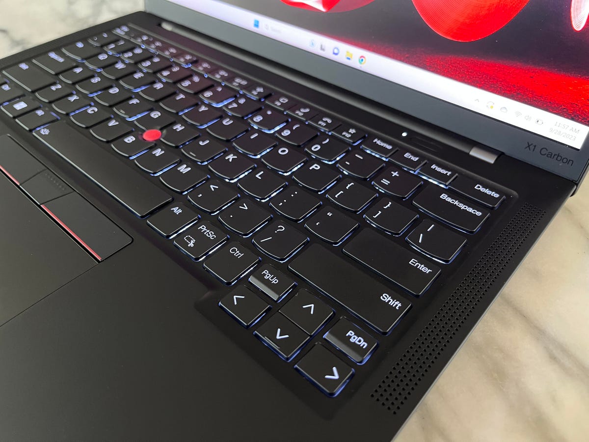 Lenovo ThinkPad X1 Carbon Gen 11 laptop at an angle to show the keyboard