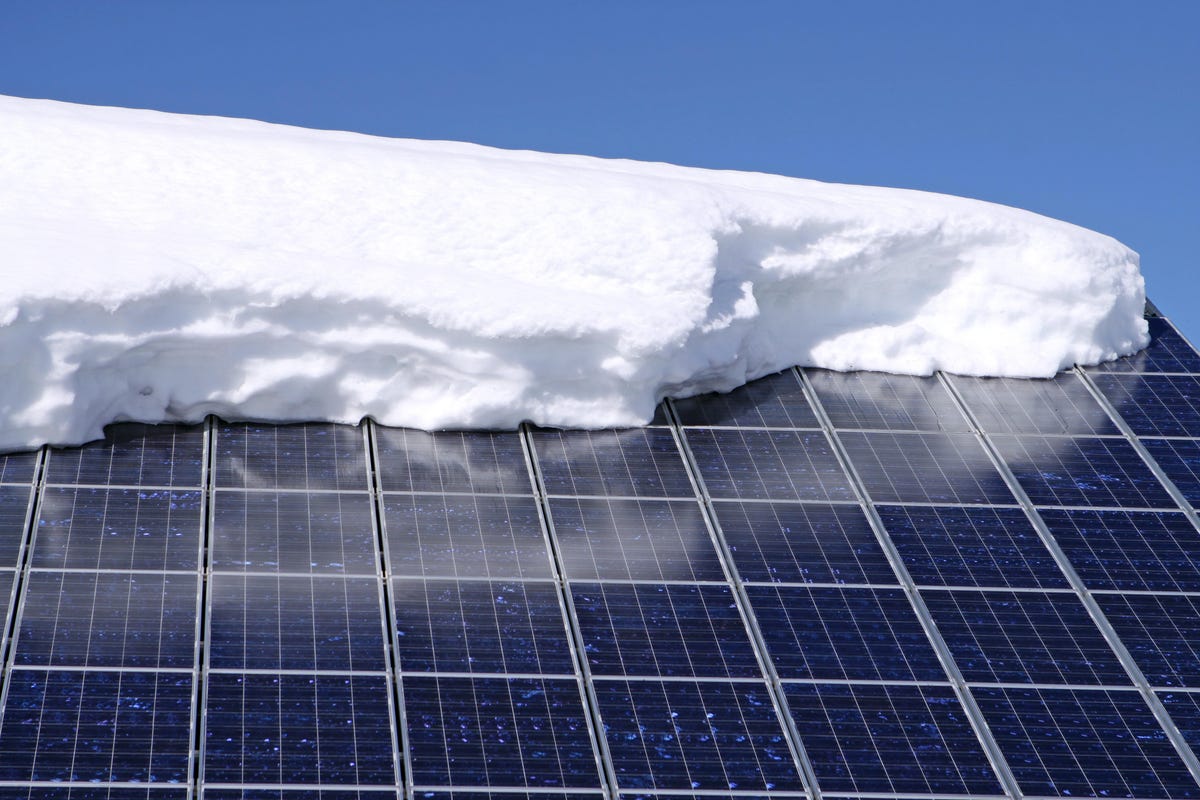 Snow on a solar panel after some snow has apparently fallen off.