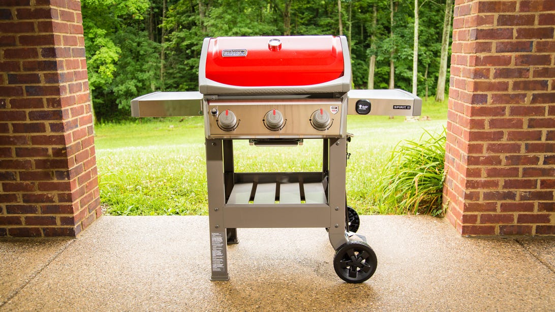 A reddish  Weber grill 