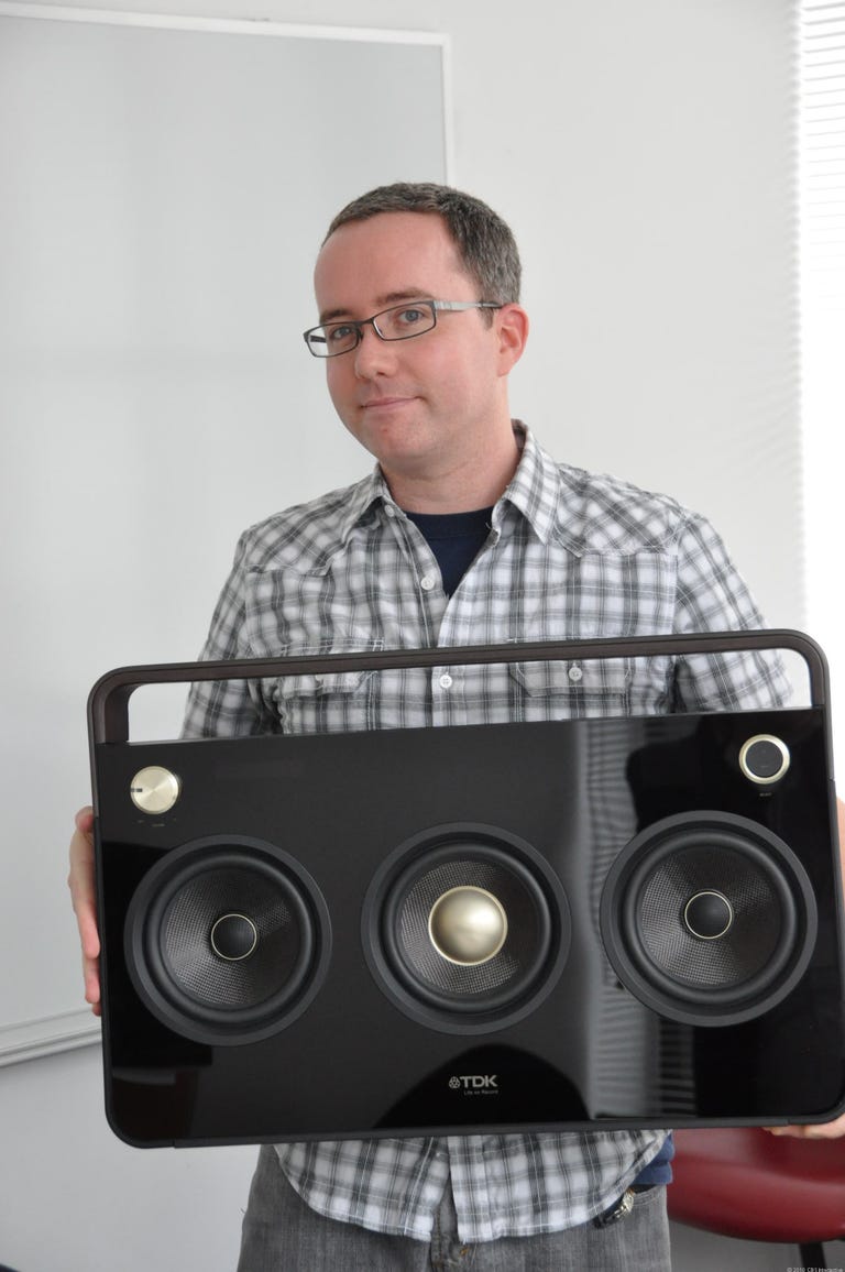 Photo of Donald Bell holding TDK boombox.