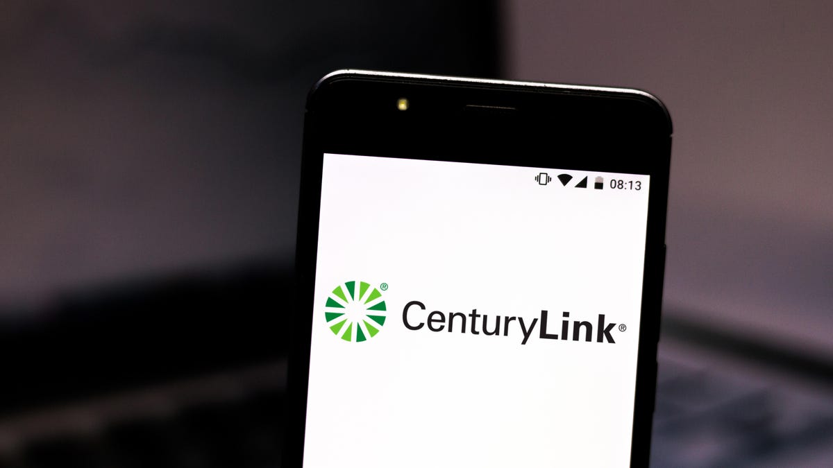 In this photo illustration a CenturyLink logo seen displayed