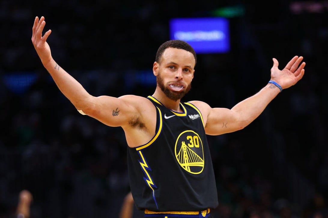 The Golden State Warriors' Stephen Curry celebrates a three-point goal in Game 4 of the NBA Finals.