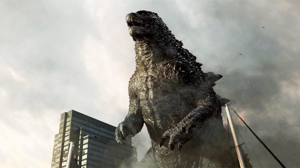 Godzilla looms over a building