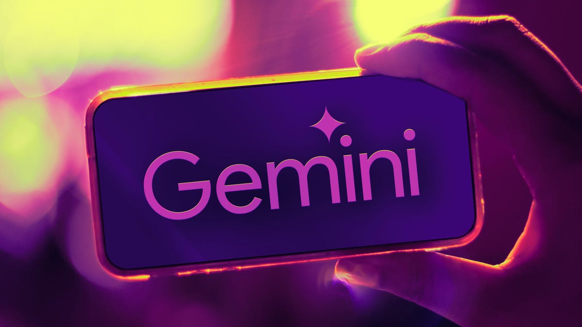Hand holding a cellphone with the Google Gemini logo on the phone screen