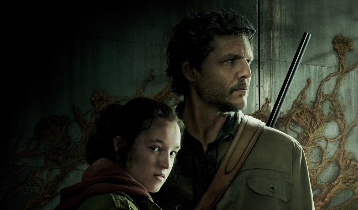 Pedro Pascal as Joel and Bella Ramsey as Ellie carry bags and weapons in The Last of Us