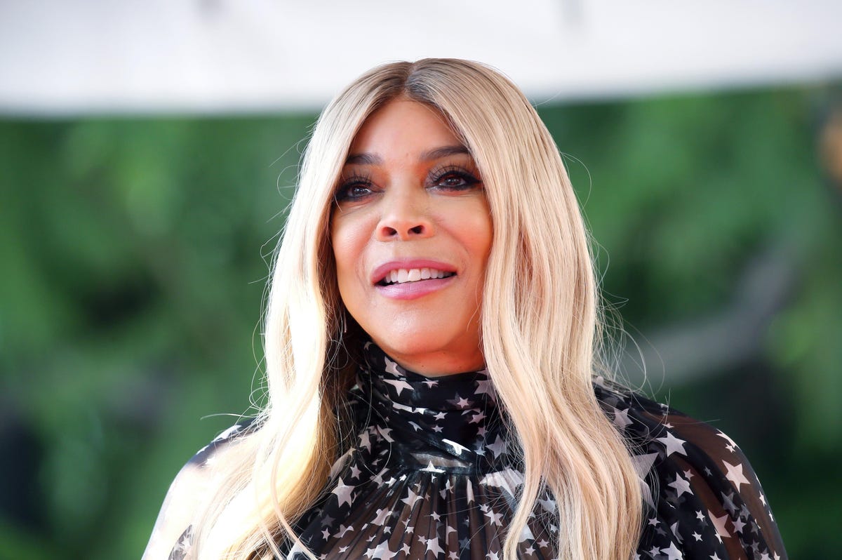 wendy williams stands on outdoor stage during walk of fame ceremony