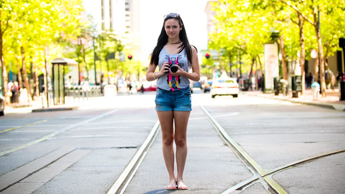 Urban hipster Carolyn LaHorgue, 17, with her grandfather&apos;s analog camera in San Francisco