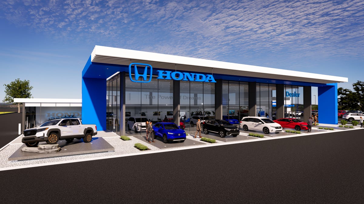 A concept Honda dealership with EV charging stations outside.