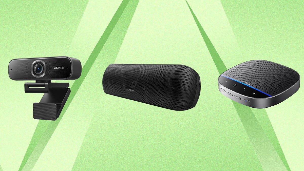 Anker speakers and webcam against a green background.
