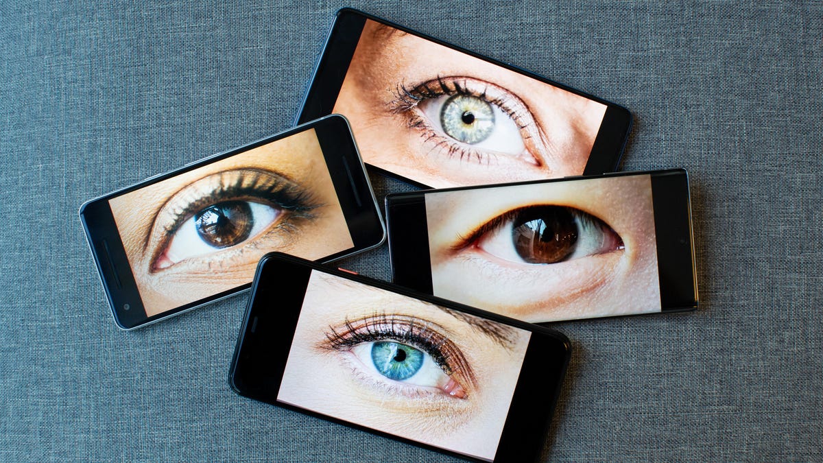 Illustration with phones featuring eyes on their screens