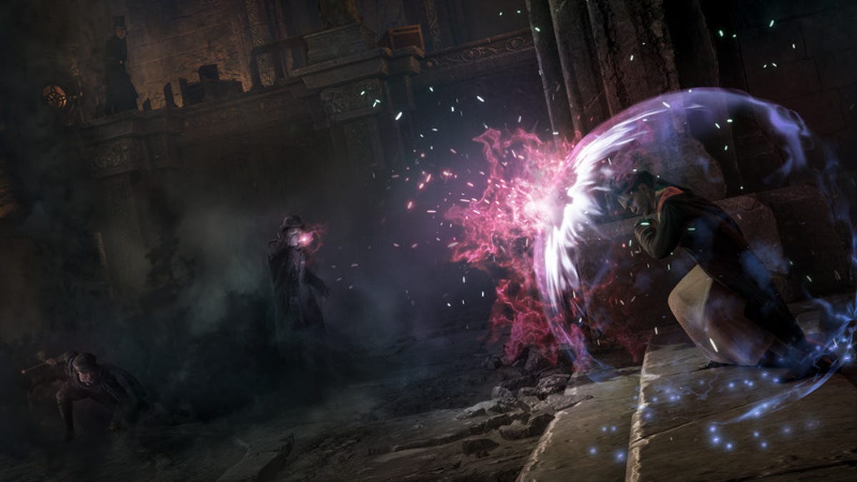 Dark wizards blast a student's shield with spells in Hogwarts Legacy