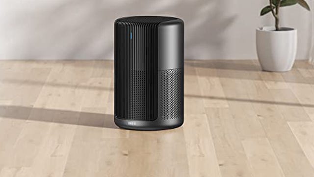 The Dreo Macro Pro Air Purifier sits on a wooden floor