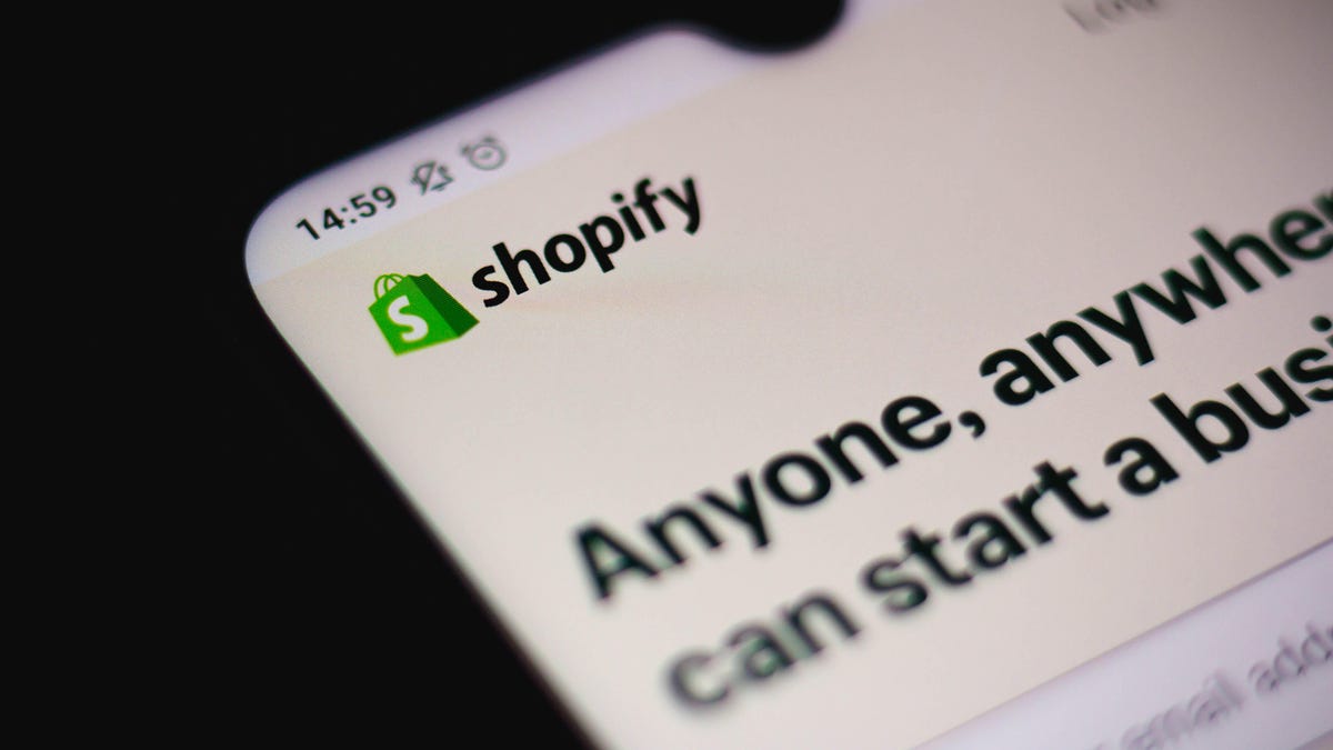 Shopify logo on a phone screen