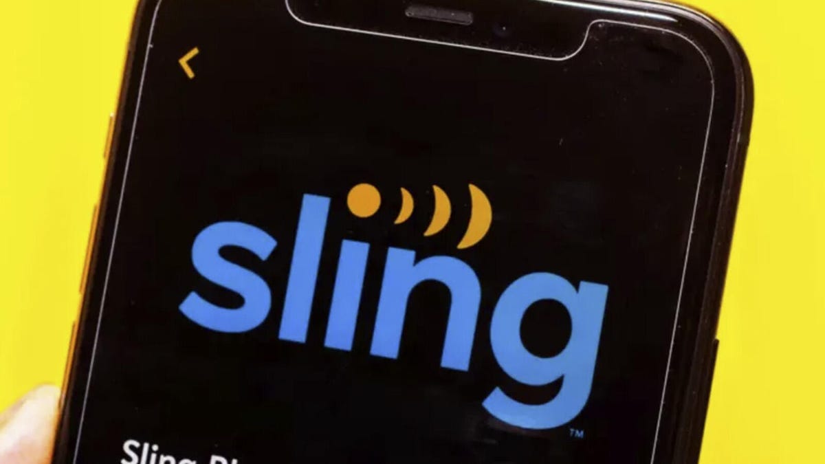 A cell phone displays the Sling TV logo.