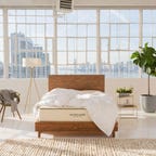 Avocado Green mattress in a brightly lit city apartment