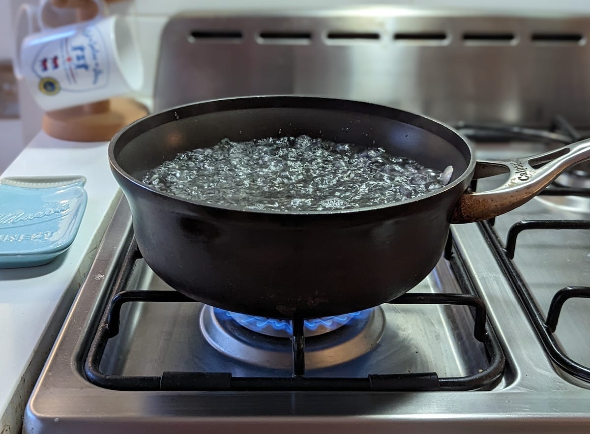 pot of boiling water over stove burner