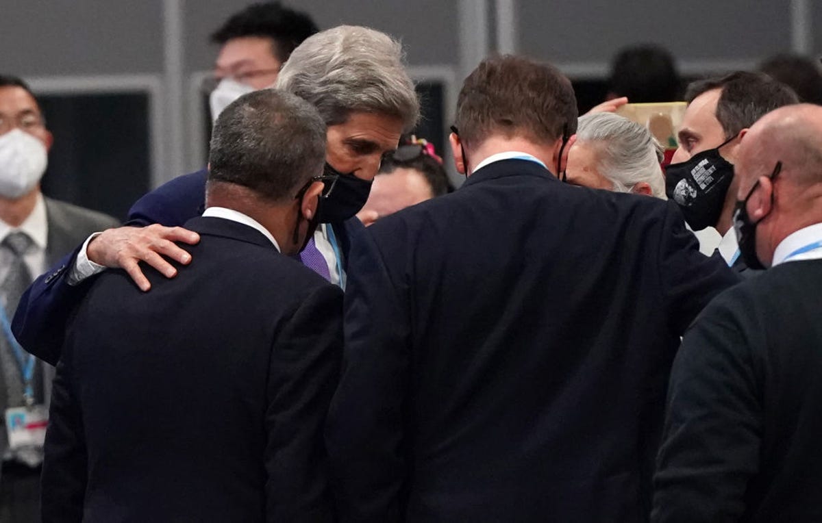 John Kerry and COP26 President Alok Sharma negotiate at the UN climate summit in November 2021.