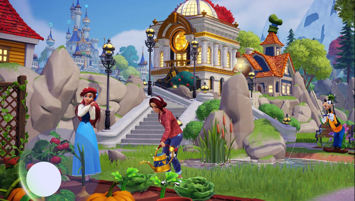 A still frame from Disney Dreamlight Valley Arcade Edition showing a person farming next to Ariel from the Little Mermaid. Goofy is in the background