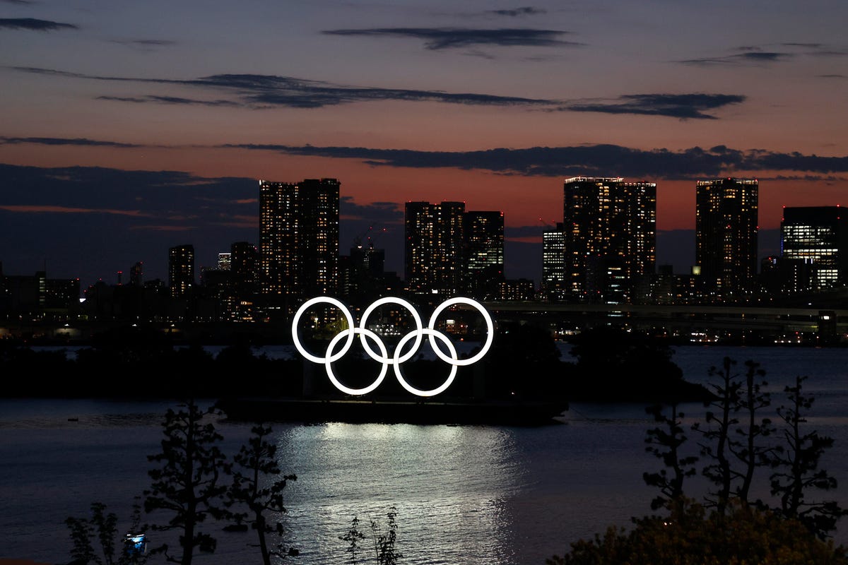 Olympic rings lit up as night falls