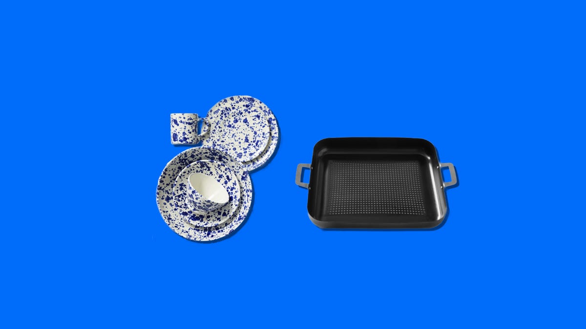 Blue and white plates and a black roasting pan on a blue background