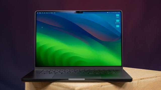 Laptop open facing you with multicolor wallpaper