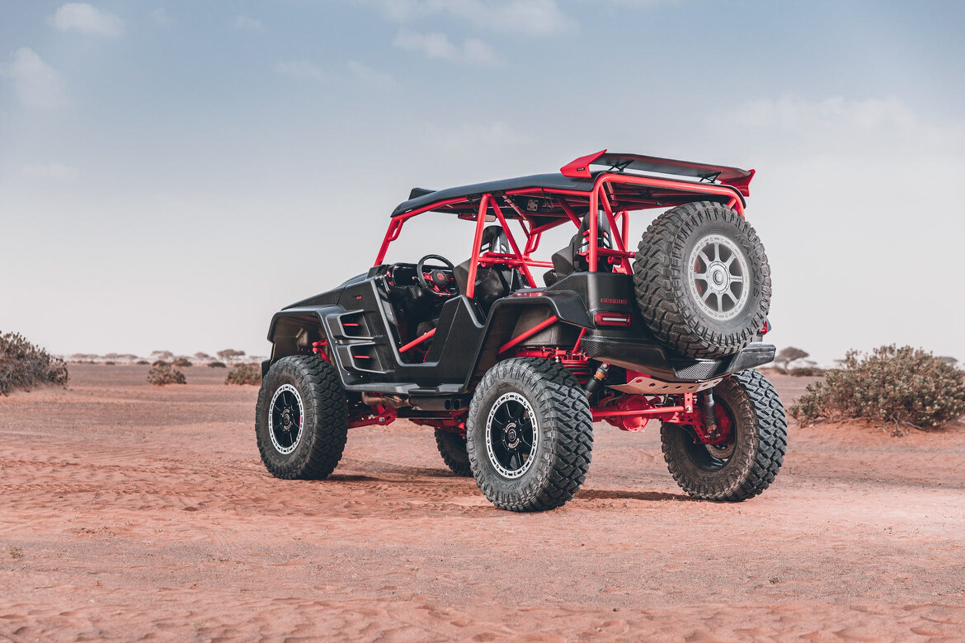 Brabus Crawler Dune Buggy parked in the desert from a rear three quarters view