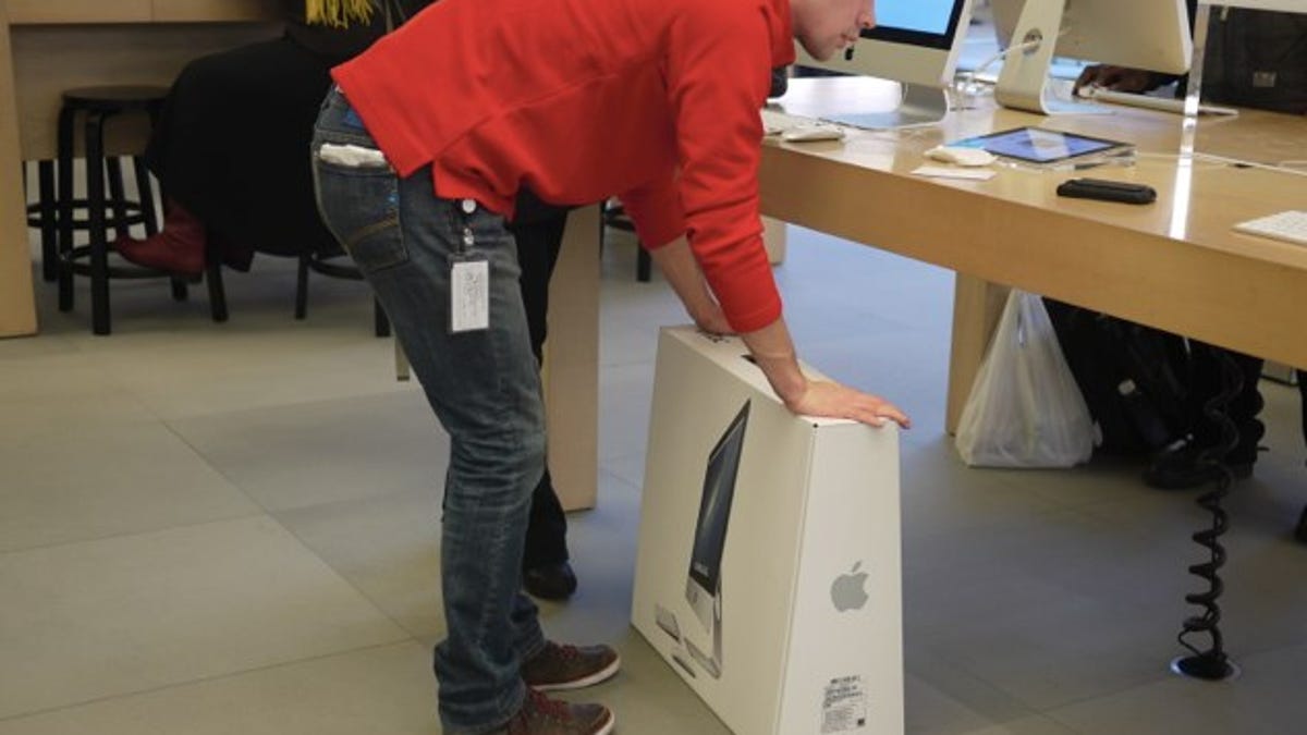 A new iMac purchased and ready to walk out the door at Apple's 5th Ave. store in New York.