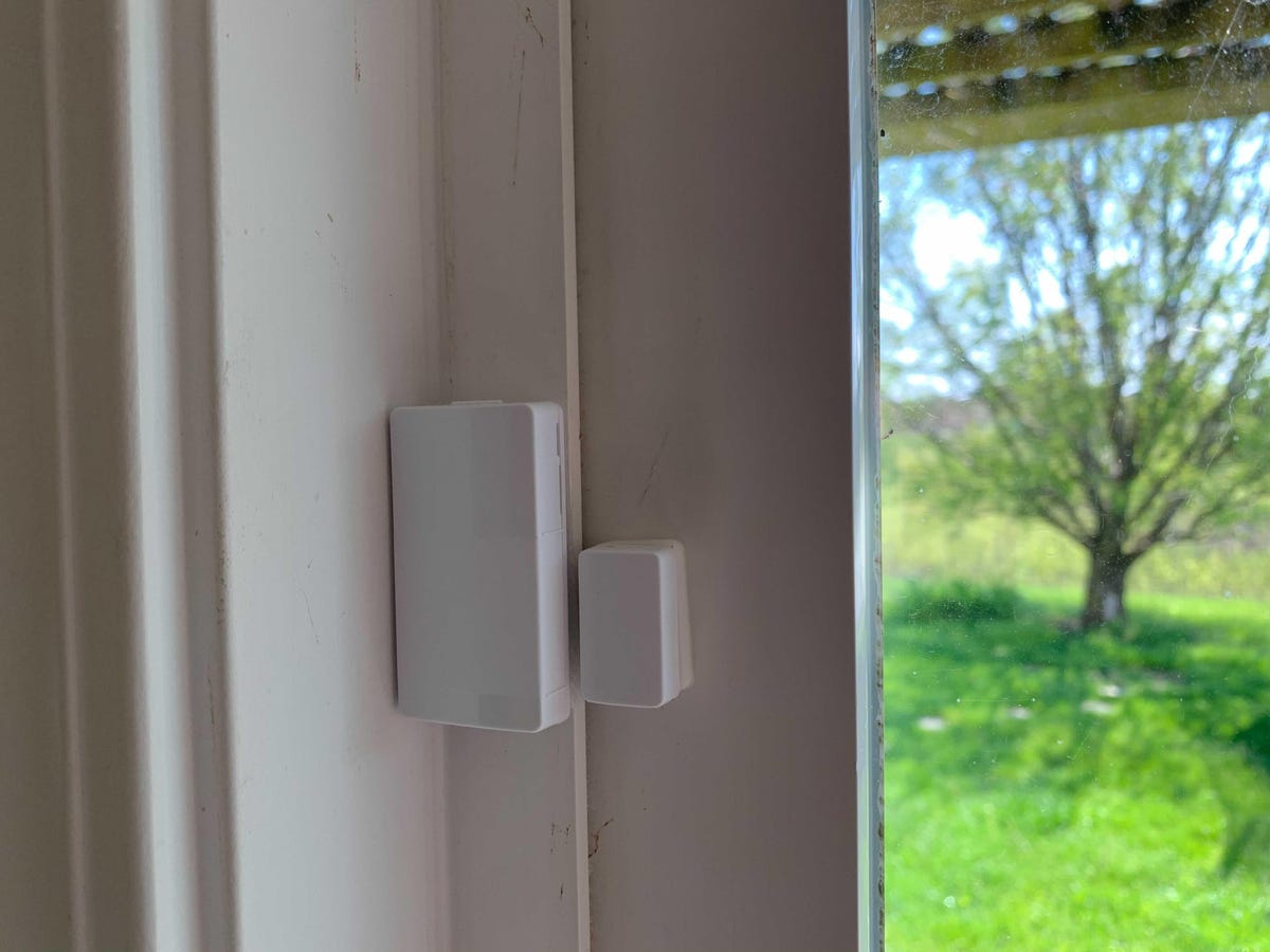Wyze window sensors stuck to the corner of a window